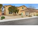 Two-story house with a large garage and landscaping at 1836 La Calera Ave, North Las Vegas, NV 89084