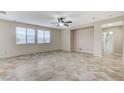 Spacious living room with tile floors and ceiling fan at 1836 La Calera Ave, North Las Vegas, NV 89084