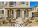 Townhome entrance with covered porch and landscaping at 20 Barbara Ln # 35, Las Vegas, NV 89183