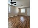 Bright living room featuring hardwood floors and plantation shutters at 336 Brilliant Summit Cir, Henderson, NV 89052