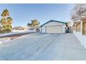 Front view of a house with a large driveway at 4323 E Twain Ave, Las Vegas, NV 89121