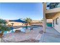 Inviting backyard oasis featuring a sparkling pool and spa at 5536 Valensole Ave, Las Vegas, NV 89141