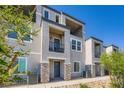 Stylish townhome featuring multi-level balconies and a well-maintained facade at 6521 Taffrail Ave, Las Vegas, NV 89118