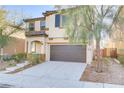 Charming two-story home with a well-manicured lawn and a two-car garage at 7659 Dewy Falls Ave, Las Vegas, NV 89179