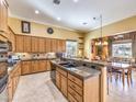 Eat-in kitchen with large island, granite counters & breakfast nook at 9 Ibis Ct, Henderson, NV 89052