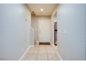 Bright entryway with tile flooring and access to stairs at 9009 Careful Canvas Ave, Las Vegas, NV 89149
