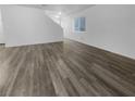 Spacious living area with grey tone laminate flooring at 9133 Black Beauty St, Las Vegas, NV 89113