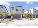 Two-story house with gray garage door and landscaped yard at 10009 Cabernet Hills St, Las Vegas, NV 89141