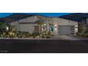 Sleek, modern home with gray siding and a teal front door at 10271 Meridian Hill Ave, Las Vegas, NV 89135