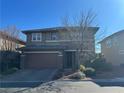 Two-story house with stone accents and a two-car garage at 10273 Aragon Crown Rd, Las Vegas, NV 89135