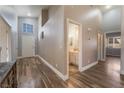 Light-filled entryway with wood-look floors and powder room at 1064 Wide Brim Ct, Henderson, NV 89011