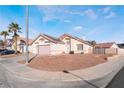 Single-story house with pink garage door, solar panels, and desert landscaping at 1064 Wide Brim Ct, Henderson, NV 89011