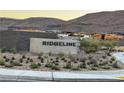 Ridgeline community entrance with landscaping and mountain views at 10739 Agate Cliffs Ave, Las Vegas, NV 89135