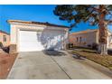 Attached garage with a large driveway at 2204 Kendall Hill Ave, Las Vegas, NV 89106