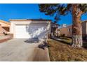 House exterior featuring a garage and driveway at 2204 Kendall Hill Ave, Las Vegas, NV 89106