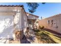 Front view of house with walkway and landscaping at 2204 Kendall Hill Ave, Las Vegas, NV 89106