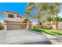 Two-story house with a landscaped yard, large tree, and a two-car garage at 3655 Funston Way, Las Vegas, NV 89129