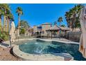 Inviting backyard pool with a covered patio and lush landscaping at 3655 Funston Way, Las Vegas, NV 89129