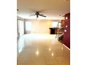 Spacious living room featuring tile floors and a ceiling fan at 529 Beckton Park Ave, Las Vegas, NV 89178