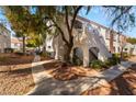 Condo building exterior showcasing landscaping and walkway at 700 Carnegie St # 2914, Henderson, NV 89052