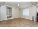 Spacious dining room with tile flooring and a ceiling fan at 8467 Bismark Sapphire St, Las Vegas, NV 89139