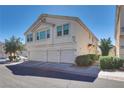 Three-story townhome with a three-car garage and nicely landscaped yard at 8627 Roping Rodeo Ave # 103, Las Vegas, NV 89178