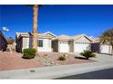 Single-story house with a two-car garage and nicely landscaped yard at 8772 Rio Grande Falls Ave, Las Vegas, NV 89178