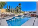 Inviting backyard oasis featuring a sparkling pool and relaxing patio area at 9636 Swan Bay Dr, Las Vegas, NV 89117