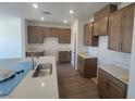 Well-lit kitchen showcases white countertops, grey cabinets, and stainless steel sink at 10039 Sir Atlas Ct, Las Vegas, NV 89148