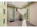 Inviting entryway with two light green doors and potted plant at 10286 Jade Gardens Dr, Las Vegas, NV 89135