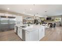 Spacious kitchen with white cabinets, large island, and stainless steel appliances at 10286 Jade Gardens Dr, Las Vegas, NV 89135