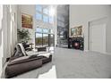 Bright living room with a marble fireplace and large windows at 10955 Mojave Spring Dr, Las Vegas, NV 89135