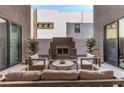 Relaxing patio with built-in fireplace and comfortable seating at 220 Glen Lee St, Henderson, NV 89012