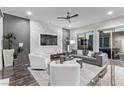 Spacious living area featuring modern furniture and a marble accent wall at 220 Glen Lee St, Henderson, NV 89012