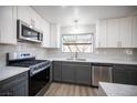 Newly remodeled kitchen with gray and white shaker cabinets at 2541 Showcase Dr, Las Vegas, NV 89134