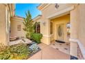 Charming courtyard entry with fountain and lush landscaping at 2589 Sumter St, Henderson, NV 89052