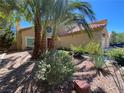 Mediterranean style home with palm trees and drought-tolerant landscaping at 2908 Channel Bay Dr, Las Vegas, NV 89128