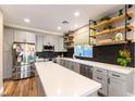 Modern kitchen with ample counter space, stainless steel appliances, and stylish cabinetry at 2924 Rain Lily Ct, Las Vegas, NV 89117