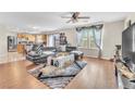 Open living room with hardwood floors and kitchen view at 3257 Aiken St, North Las Vegas, NV 89032