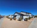 Side view of the house showing additional landscaping and a walkway at 4017 Danford Pl, Las Vegas, NV 89102