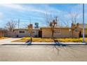 Single story home with a well-maintained front yard at 4116 E Ogden Ave, Las Vegas, NV 89110