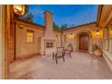 Charming courtyard with fireplace and seating area at 59 Portezza Dr, Henderson, NV 89011