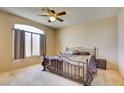 Spacious bedroom with large window and king-size bed at 7741 Orchard Wood Ct, Las Vegas, NV 89131