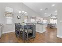 Bright dining area with hardwood floors and a gray table at 7859 Lisa Marie Ct, Las Vegas, NV 89113