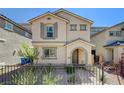 Two-story house with gray exterior and a brown door at 8035 Skye Foxx St, Las Vegas, NV 89166