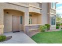 Attractive entryway with landscaping and a brown door at 8805 Jeffreys St # 1032, Las Vegas, NV 89123