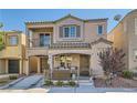 Two-story house with balcony and landscaped front yard at 9103 Mcginnis Ave, Las Vegas, NV 89148