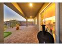 Covered patio with brick pavers and built-in grill at 928 Calluna Hills Ln, Las Vegas, NV 89138