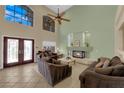 Comfortable living room with fireplace and plenty of natural light from the large windows at 9852 Snowy Canyon Ct, Las Vegas, NV 89183