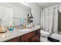 Clean bathroom with a shower/tub combo and granite countertop at , Las Vegas, NV 89103